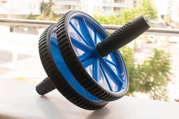 Workout fitness exercise roller, training wheel in balcony view.
