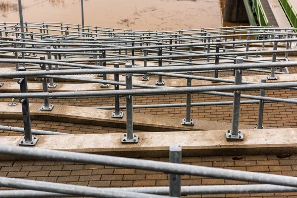 metal pedestrian bridge details in city of Bauska, Latvia. abstract texture and lines in cloudy spring day