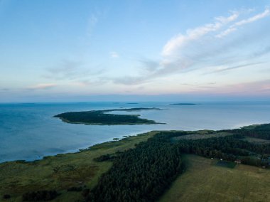 drone image. aerial view of sunrise over the islands in Baltic sea, Hiiumaa, Estonia in summer clipart