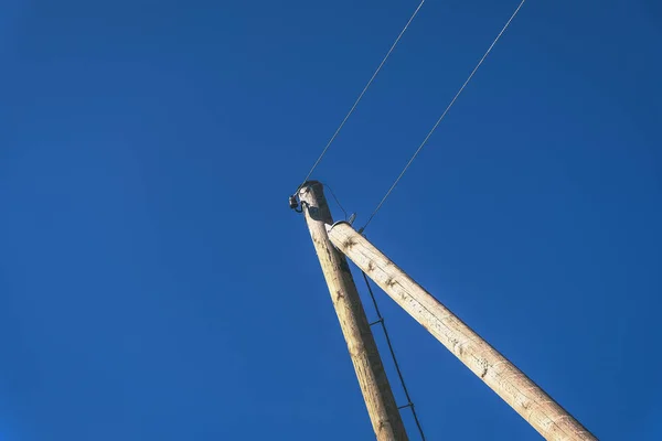 Elektriciteit Lijn Palen Draden Blauwe Hemel Achtergrond — Stockfoto