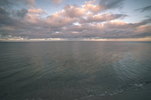 blue sky over calm water in summer