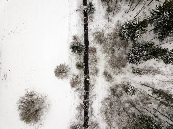 country small river lines in field in winter