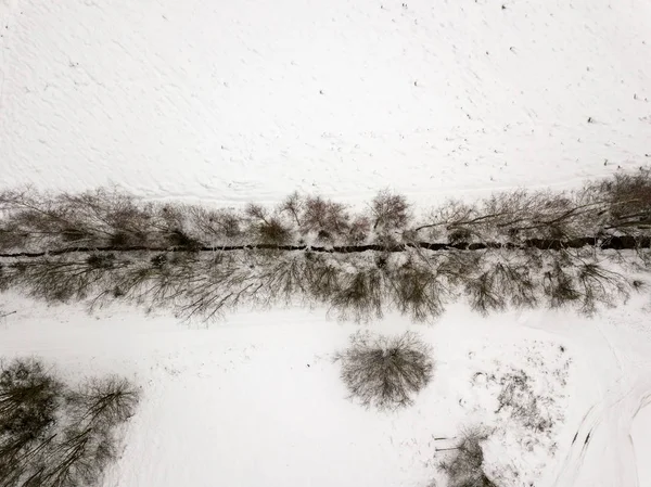 country small river lines in field in winter