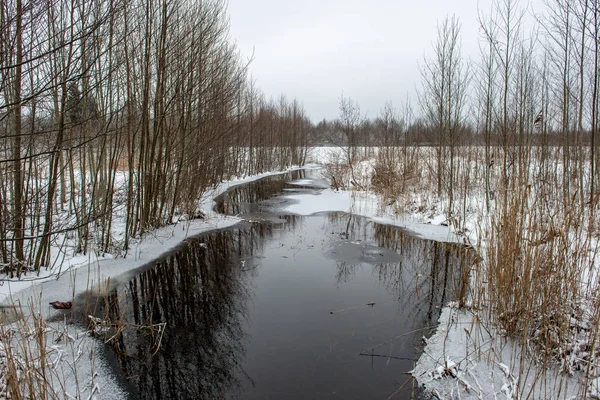frozen bodies of water in deep winter under snow