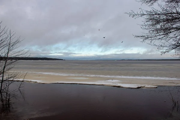 frozen bodies of water in deep winter under snow