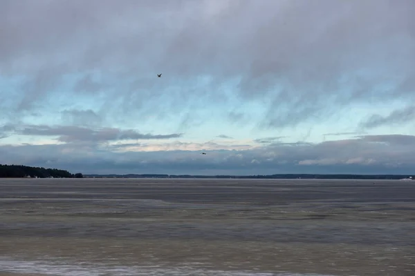 frozen bodies of water in deep winter under snow