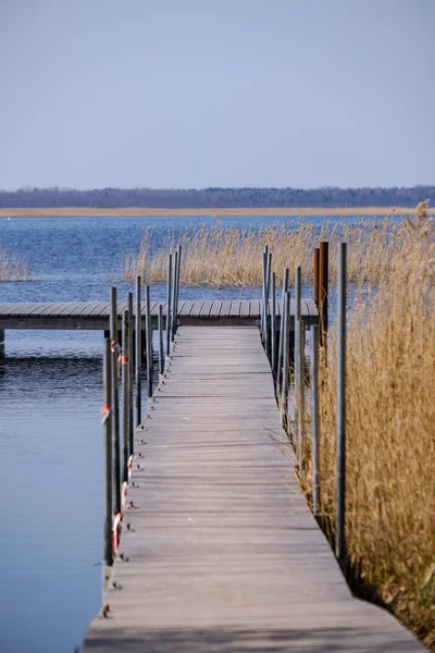 wooden plank foothpath boardwalk trampoline in the lake