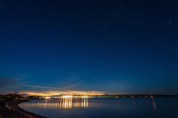 night sky with stars and clouds in long exposure shot