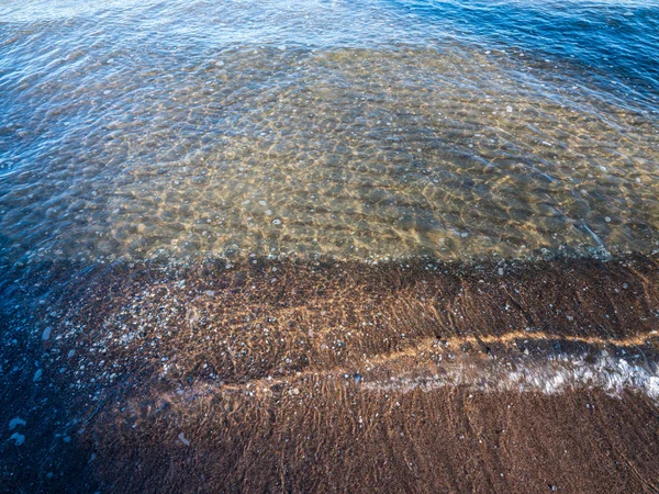 Windy sea beach with white sand and blue water — 스톡 사진