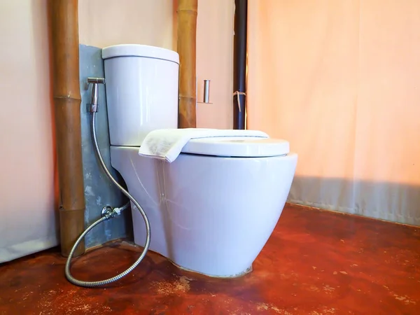 flush toilet water closet with towels Loft style bathroom decoration