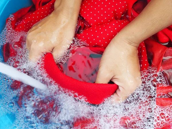 Person Washing Clothes Hands Using Detergents Soak Red Fabric Shirt — Stock Photo, Image