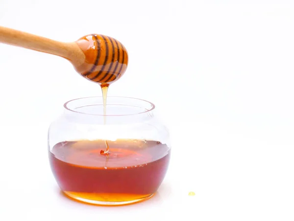Drop Honey Wooden Honey Stick Clear Glass Jar Isolated White — Stock Photo, Image