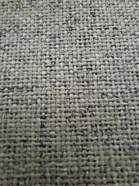 Gri-yeşil melanj kumaş. Yaklaş.