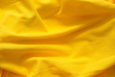 Arkaplan için sarı kumaşın yüzeyi