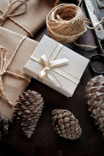 Close-up of gift packages wrapped in kraft and white paper