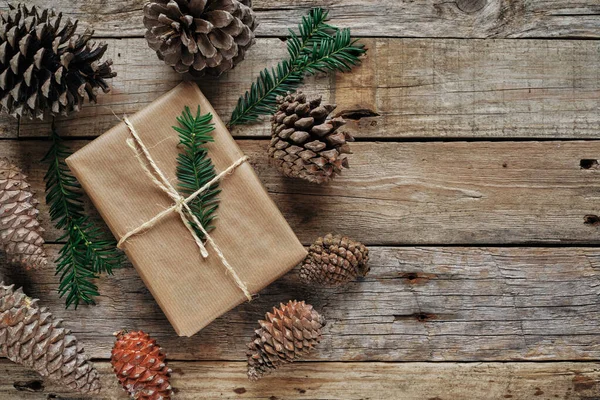 Gift Package Wrapped Kraft Paper Tied Rope Surrounded Pineapples — Stock Photo, Image