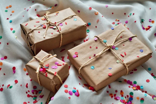 Gift Packages Wrapped Jute Paper Wrinkled White Cloth Confetti — Stock Photo, Image