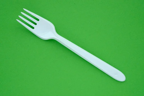 White Plastic Fork Green Background — Stock Photo, Image