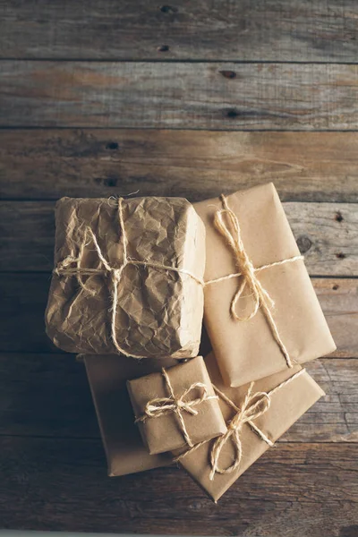 Packages wrapped in kraft paper tied with jute