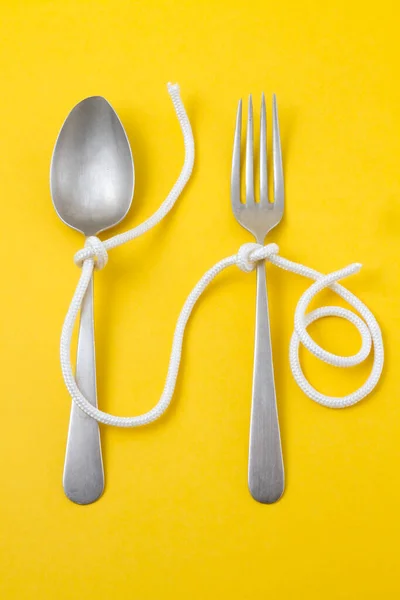 Spoon Fork Tied Yellow Background — Stock Photo, Image