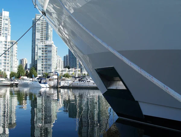 a wonderful view of the city with the hull of a boat in the foreground