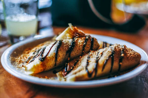 Two Crepes Sit Plate Outdoor Cafe Crepes Filled Bananas Nutella — Stock Photo, Image