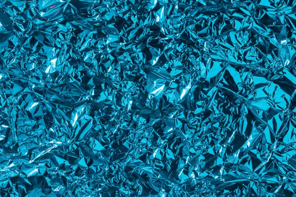 Fondo azul abstracto hecho de lámina arrugada . —  Fotos de Stock