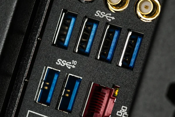 Close up of input output panel in the back of a computer with USB 3.0 ports