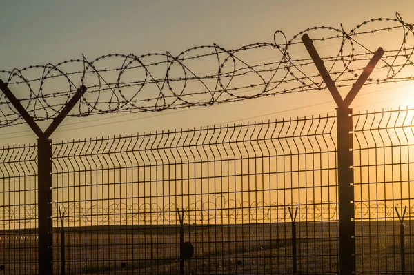 Barbed wire steel wall against the immigations — Stock Photo, Image