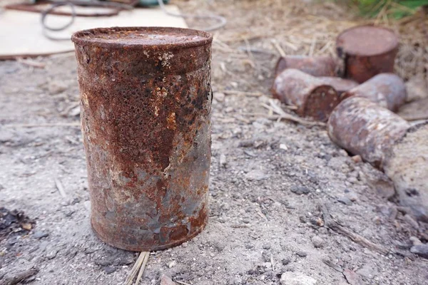 close up old rusty can on the ground