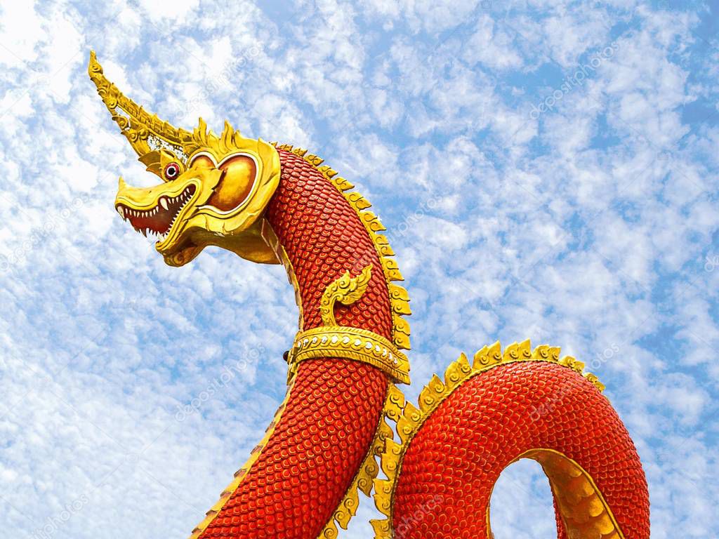 King of Naga statue on blue sky