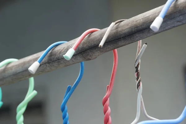 colorful hangers on bamboo pole