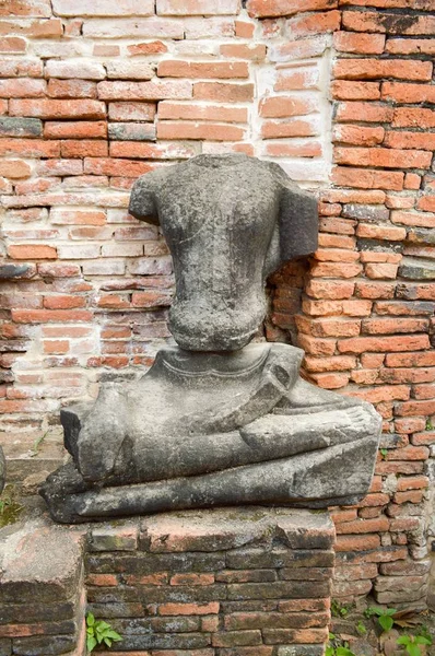 close up old broken Buddha statue at Chaiwatthanaram Temple, Ayutthaya, Thailand