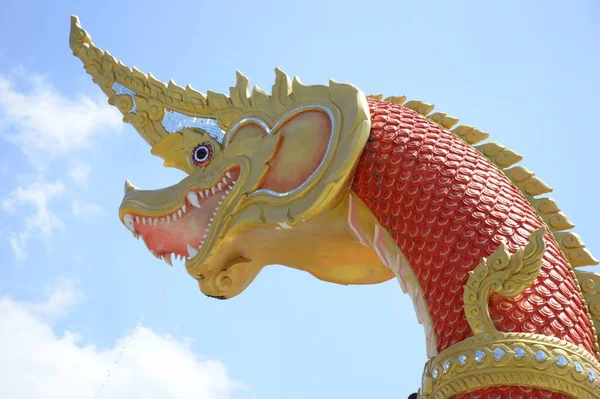 close up red dragon statue in the temple