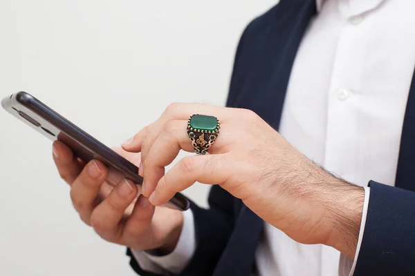 Man hand with silver rings on his fingers.