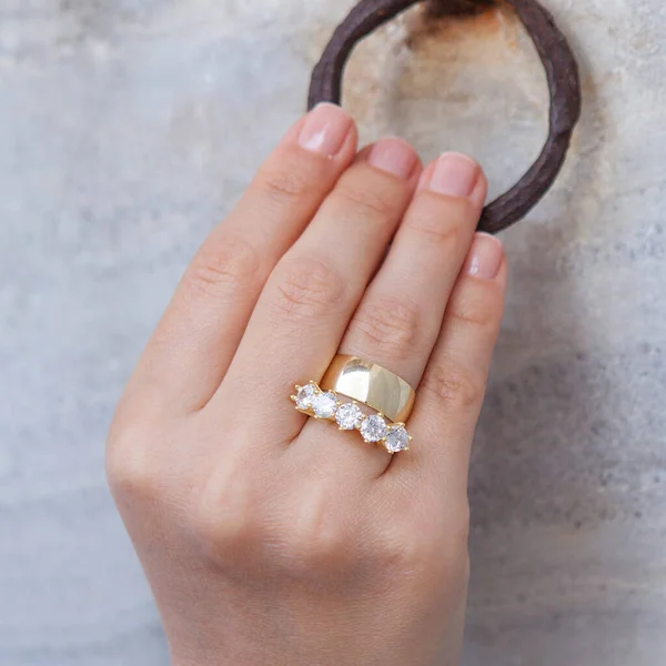 Silver, patterned wedding rings on the female model, different color on the back.