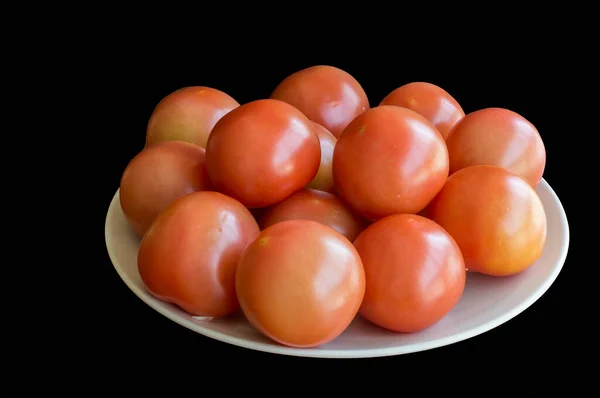 Tomatoes isolated on black background. Tomato isolate. Tomatoes side view.