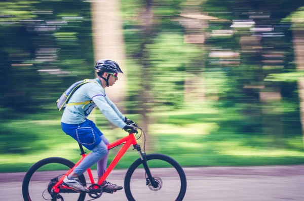 Cyclist Helmet Rides Bicycle Path Motion Blur — Stock Photo, Image