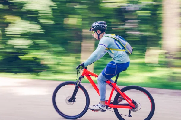 Cyclist Helmet Rides Bicycle Path Motion Blur — Stock Photo, Image