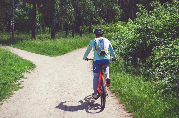 Cyclist Helmet Rides Forest Bicycle Path — Stock Photo, Image