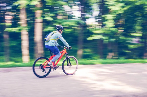 Cyclist Helmet Rides Bicycle Path Motion Blur — Stock Photo, Image