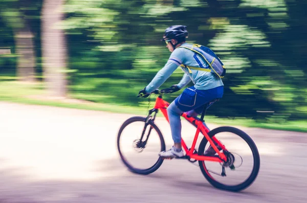 Cyclist Helmet Rides Bicycle Path Motion Blur — Stock Photo, Image