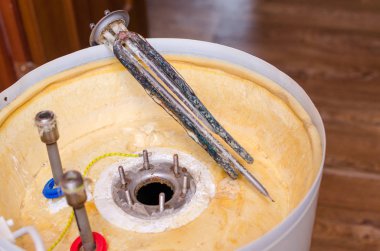 Boiler repair, replacement of broken water heating element. clipart