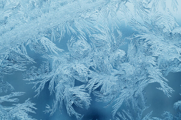 Abstract frosty pattern on glass, background texture.