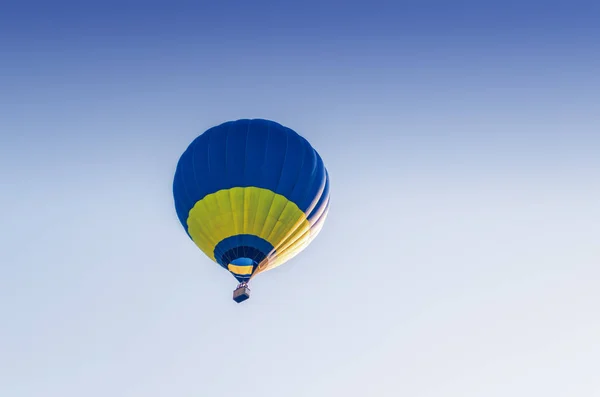 Colorful hot air balloon flying in the blue sky Royalty Free Stock Images