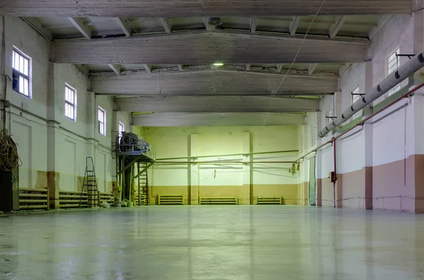 Old abandoned empty production hall, factory interior