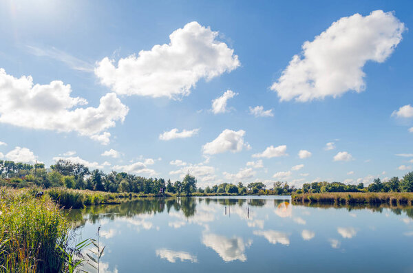 Beautiful summer landscape with a river and blue sky.
