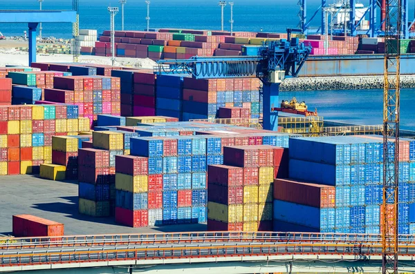 Stacked cargo containers in storage area of freight sea port — Stock Photo, Image