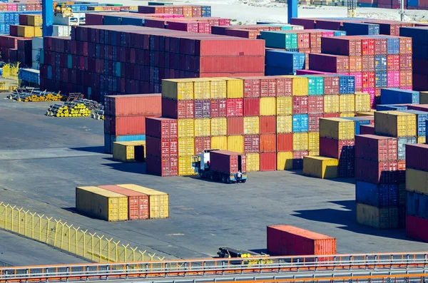 Stacked cargo containers in storage area of freight sea port — Stock Photo, Image