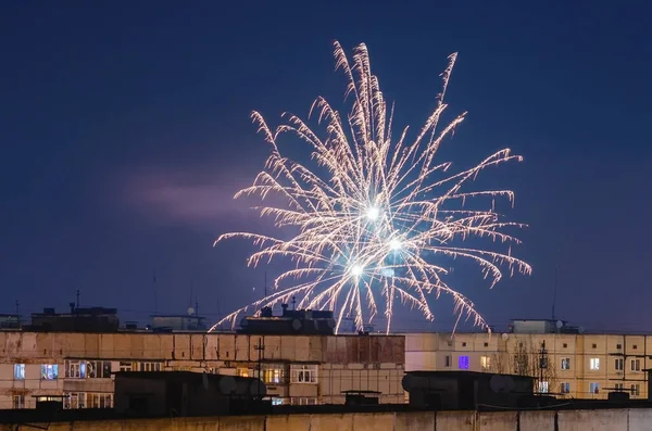 Beautiful fireworks over the roofs of houses — ストック写真